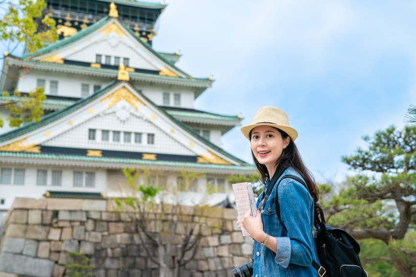 A female tourist and Osaka Castle